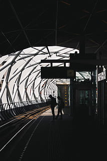 person waiting train, two people standing on train station, platform HD wallpaper