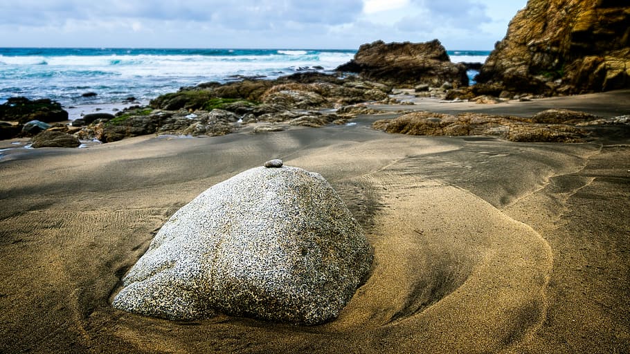 gray rock on shore beside sea at daytime, high angle photo of rock on seashore HD wallpaper