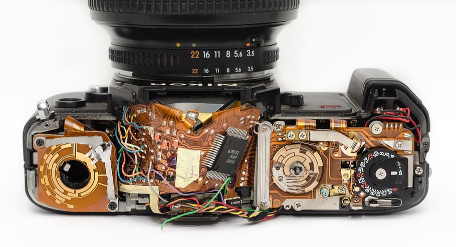 disassembled black SLR camera, inside, mechanics, technician