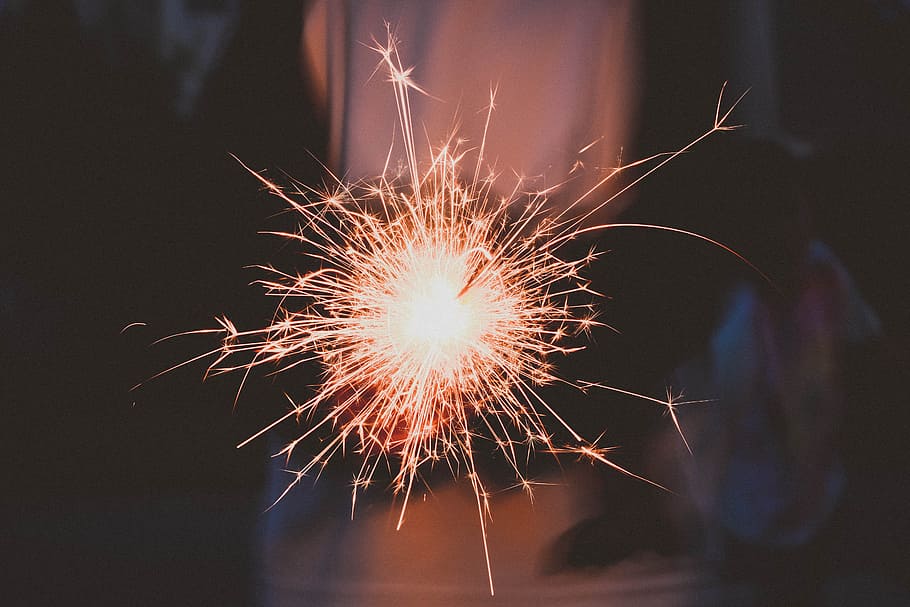 timelapse photography of sparkler, person holding sparkle, stick