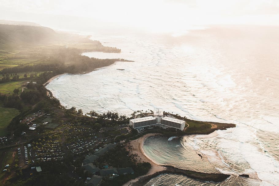 aerial photo of building near body of water, sea, ocean, waves HD wallpaper