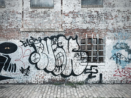 graffiti-painted brick wall, white brick building with vandal HD wallpaper