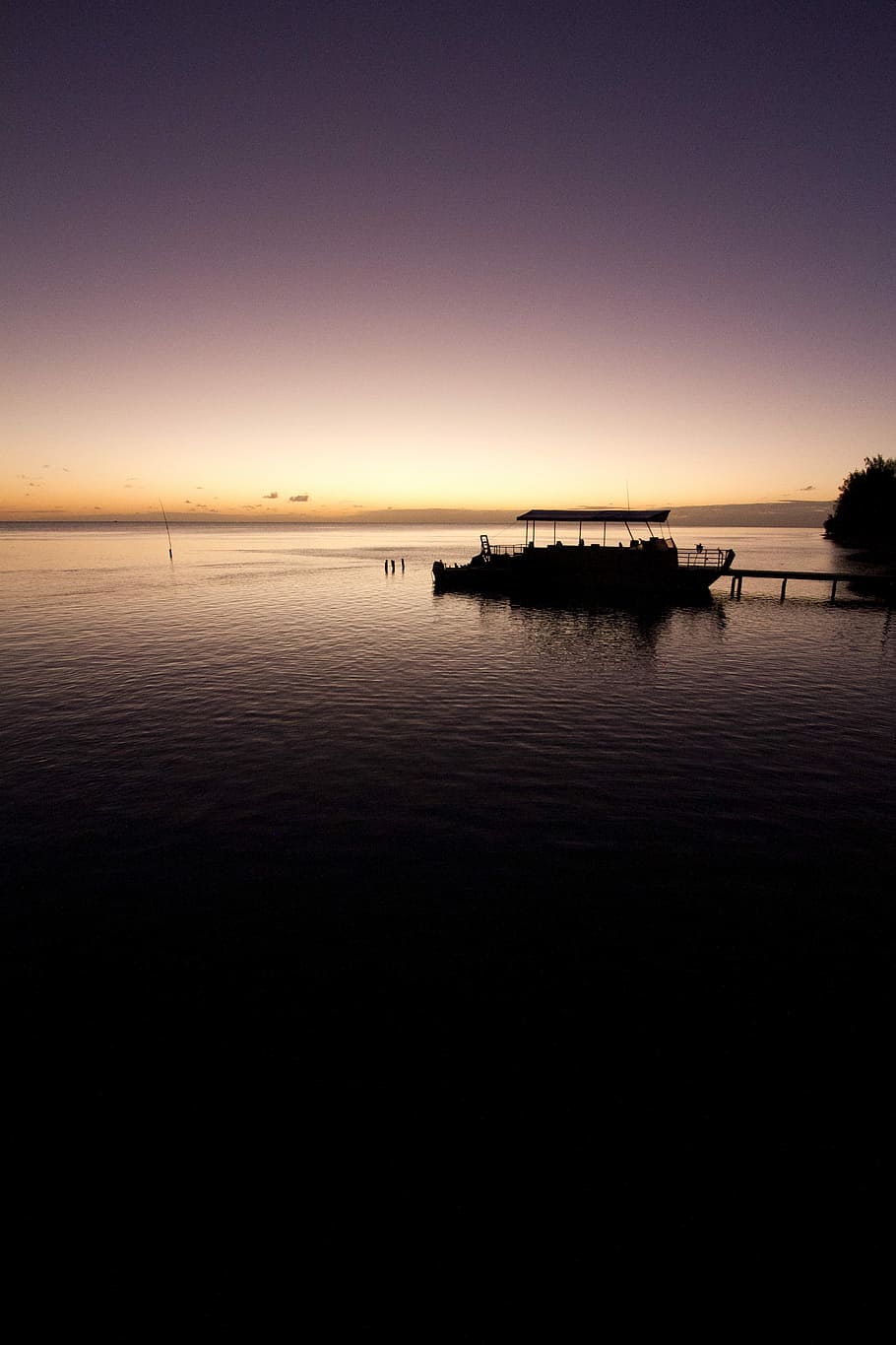 silhouette photo of boat, silhouette of boat on dock golden hour photography