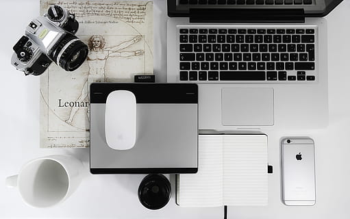 white Apple Magic Mouse, gray trackpad, gray SLR camera, space gray iPhone 6s, and MacBook Pro on table, gray and black DSLR camera near Apple Magic Mouse and MacBook Pro HD wallpaper