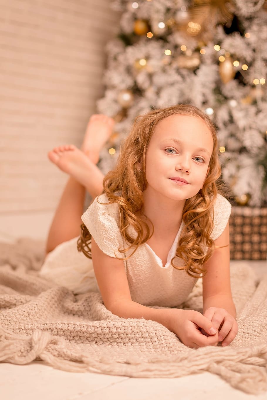 girl in white dress lying on floor near Christmas tree inside room, HD wallpaper