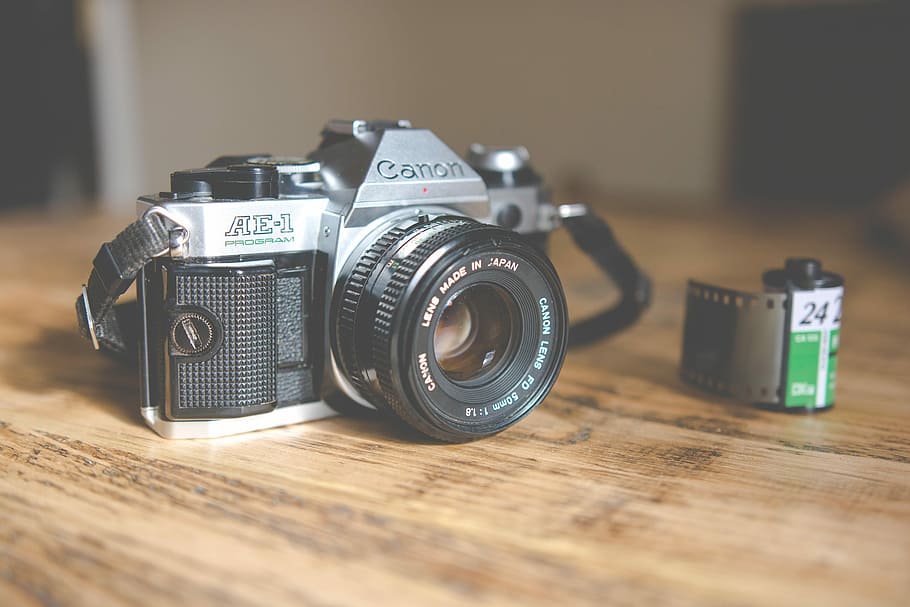 black and silver Canon point-and-shoot camera near film, black and gray Canon DSLR camera, HD wallpaper