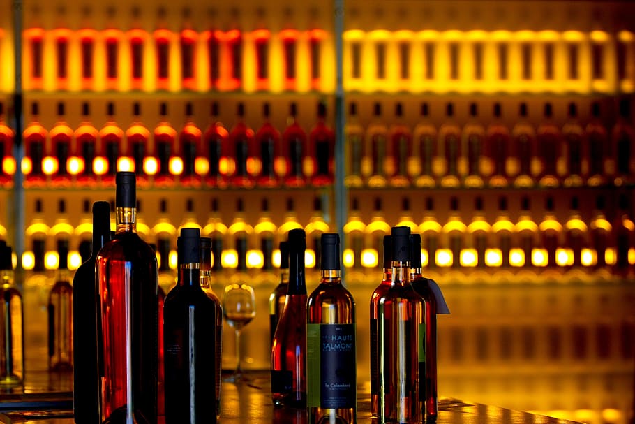 liquor bottles near bottles on rack, wines, orange, drink, alcohol HD wallpaper