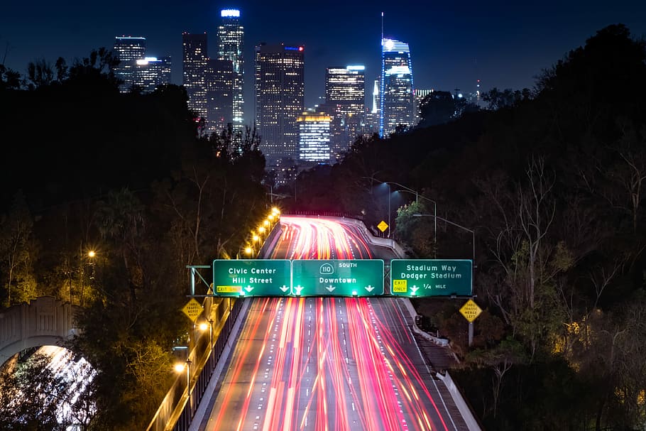 time lapse photography of highway leading to city, time-lapse photography of road HD wallpaper
