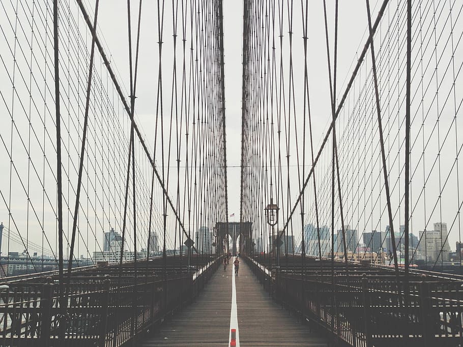 person running on bridge, people walking on the center of the bridge HD wallpaper