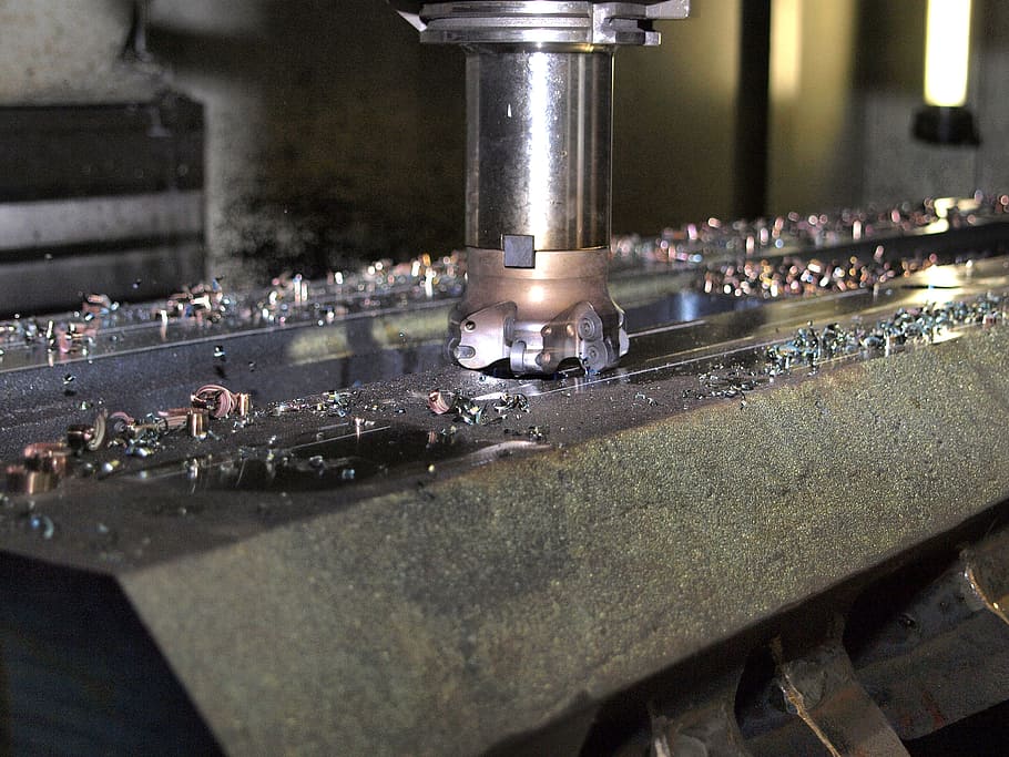 close up photo of a machine, milling, machining, cutter head