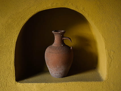 brown clay jar in yellow concrete rack, pitcher, pottery, handmade HD wallpaper
