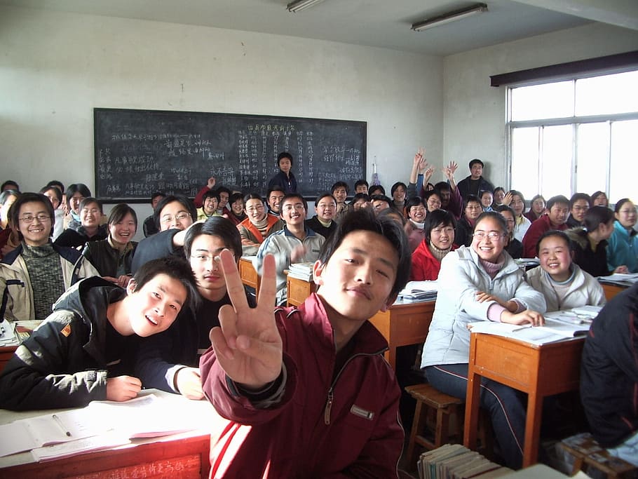 photo of group of people inside room, classroom, students, school
