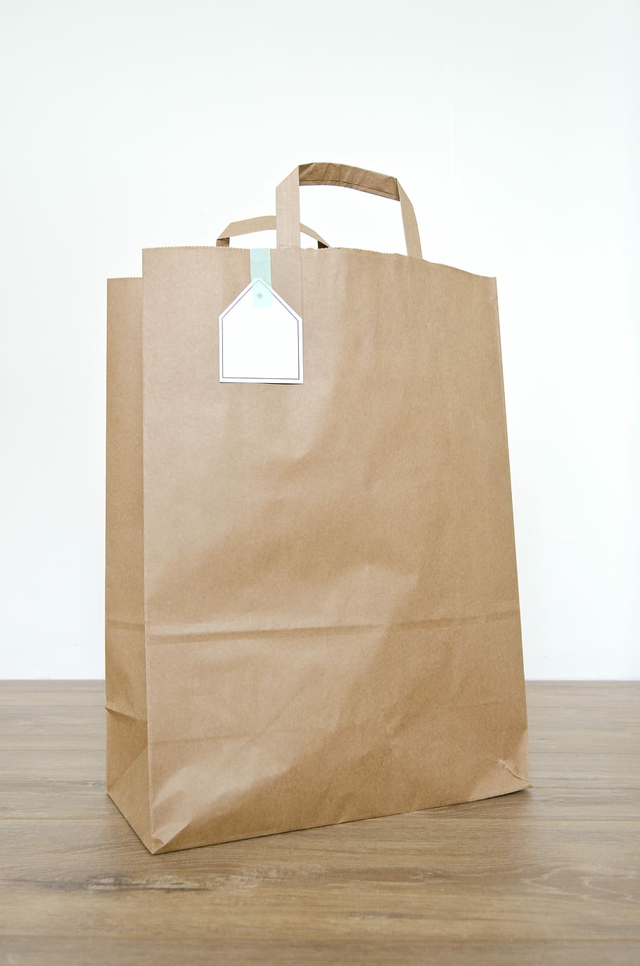 brown paper bag on brown wooden surface, blank, container, kraft