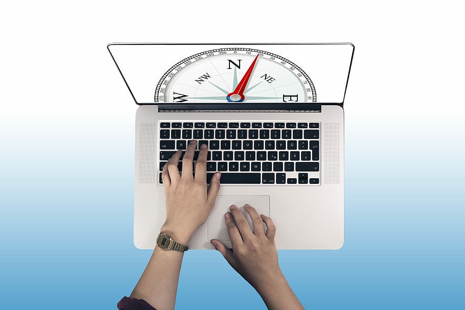 person typing on MacBook Pro, compass, orientation, direction HD wallpaper