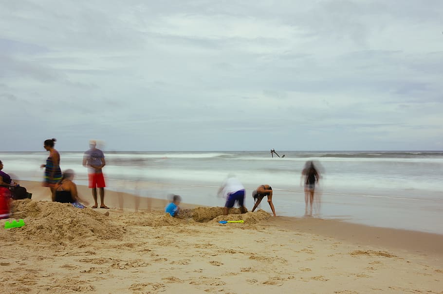 group of people standing on beach shore, digging, beach, people, cloud, sand, sea HD wallpaper