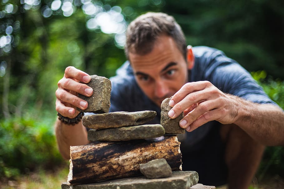 man wearing shirt and holding two stones, building, zen, boy HD wallpaper