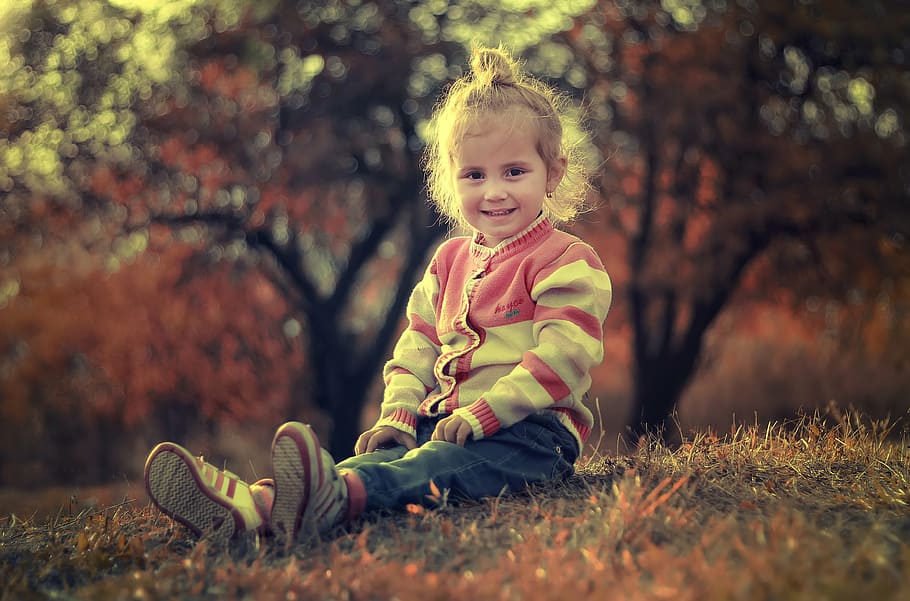 girl wearing pink and white cardigan and blue pants sitting on grasses, HD wallpaper