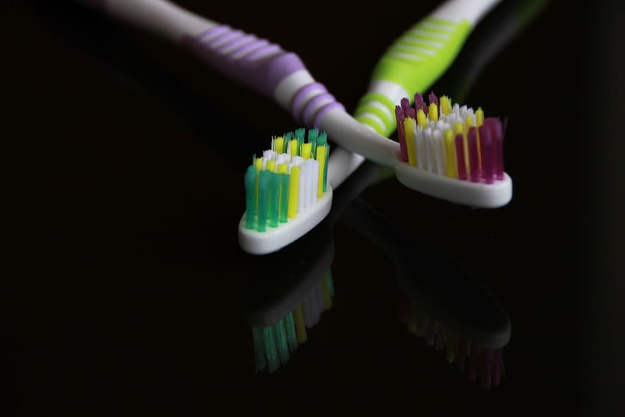 two toothbrushes on table, black, colored, dental, hygiene, oral, HD wallpaper