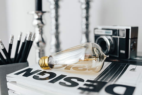 Pencils, magazines and an old lightbulb, vintage, camera, blackandwhite HD wallpaper