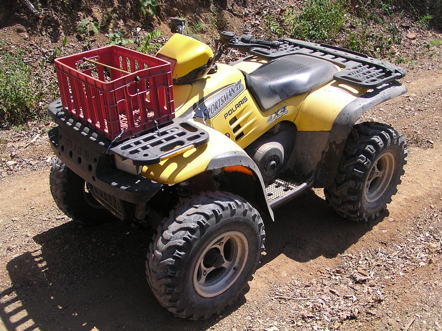 red basket on yellow and black ATV, quad, four wheel, bike, extreme