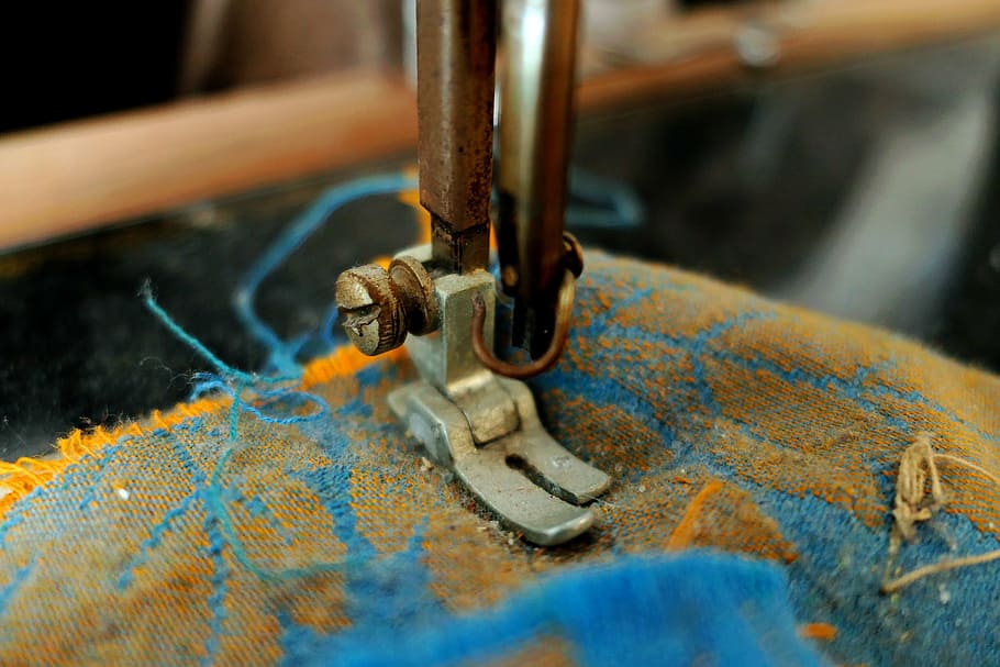 selective focus photo of a sewing machine, old sewing machine