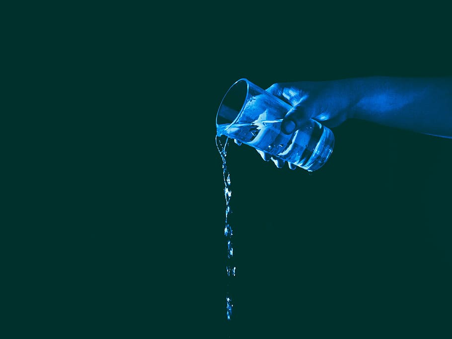 person holding a glass cup of water pouring it down, still HD wallpaper