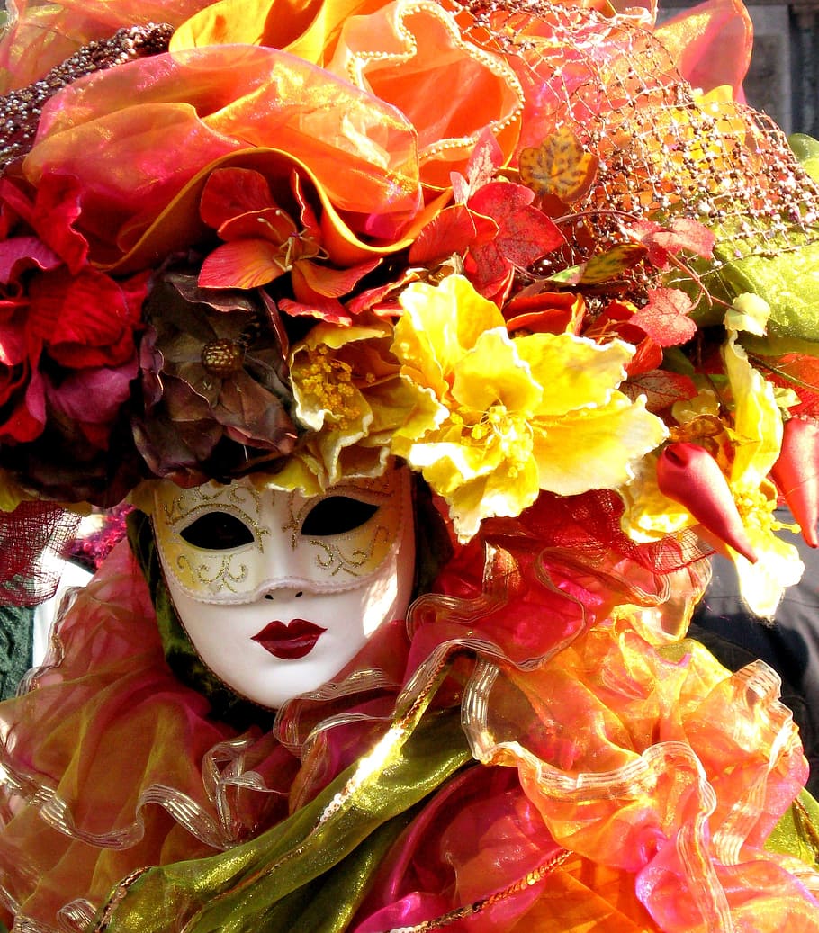 white mask surrounded by artificial flowers, Venice, Carnival