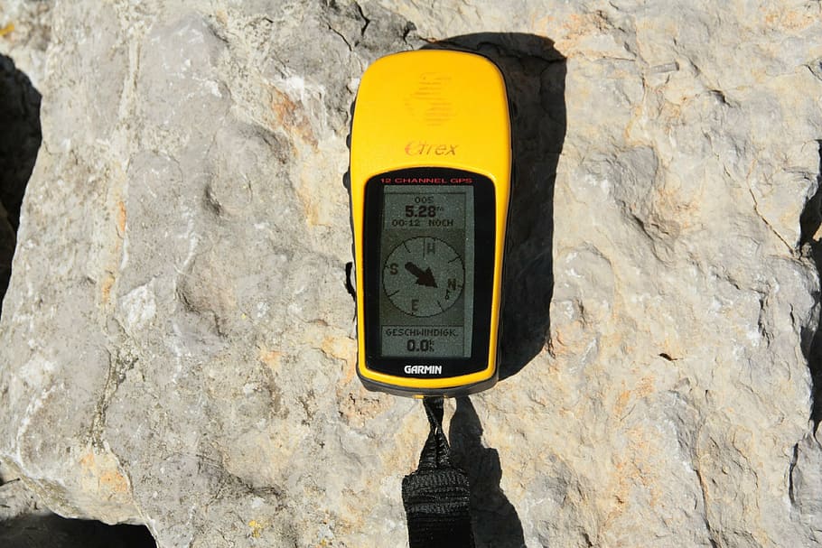 turned-on yellow and black digital cordless device, gps, geocaching