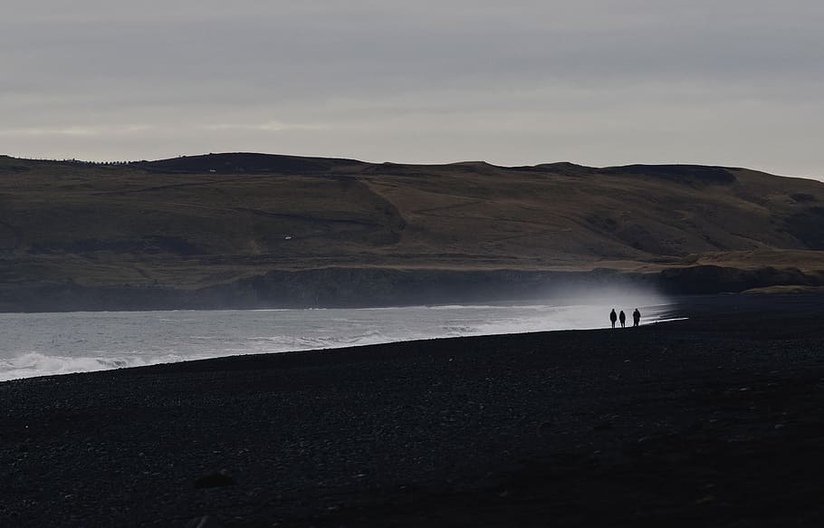three persons in seashore at daytime, landscape photography of mountain HD wallpaper