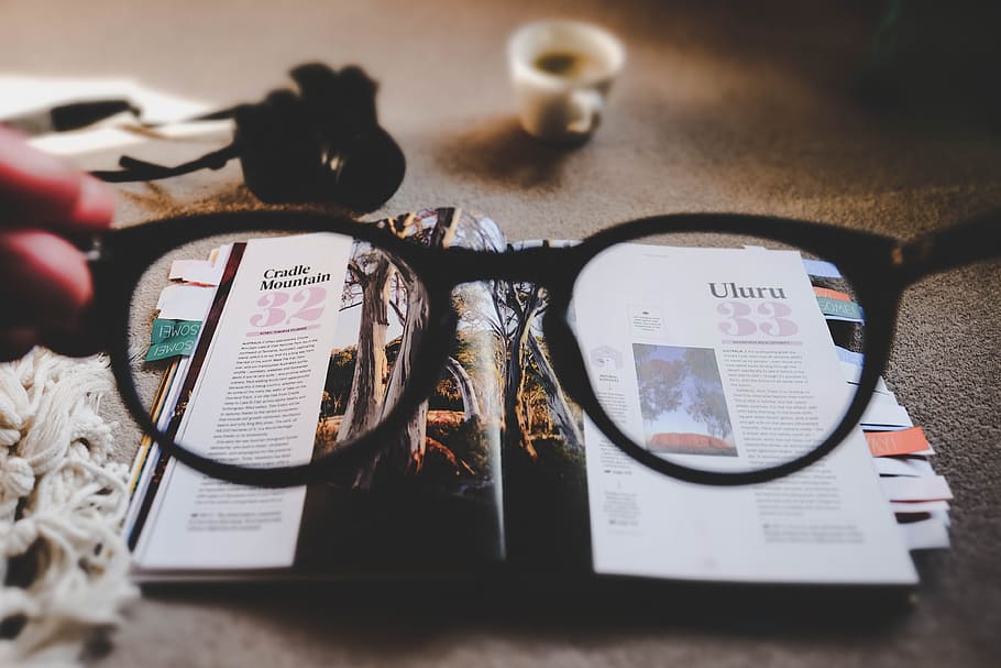 eyeglasses with brown frames and open book, black framed eyeglasses looking at magazine, HD wallpaper