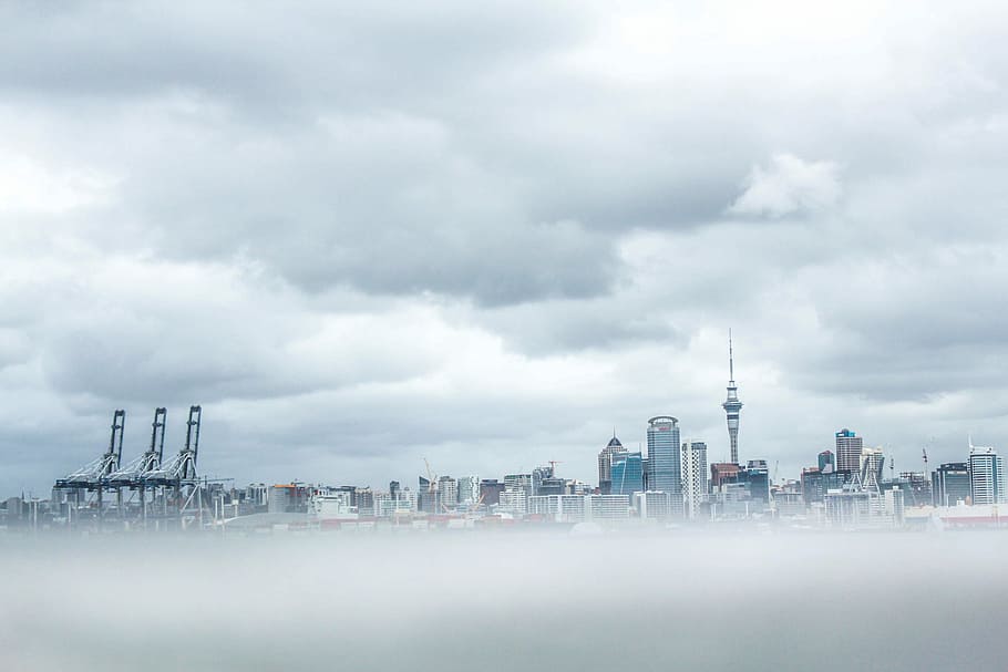 concrete high-rise building, gray buildings surrounded fog, city HD wallpaper