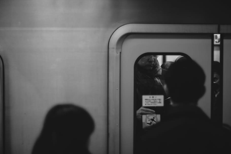 person standing on train door, grayscale photo of man standing front of train, HD wallpaper