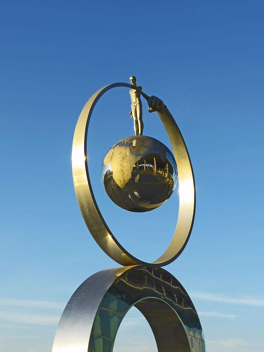 globe, finger, sculpture, circle, pointing, blue sky, gold HD wallpaper