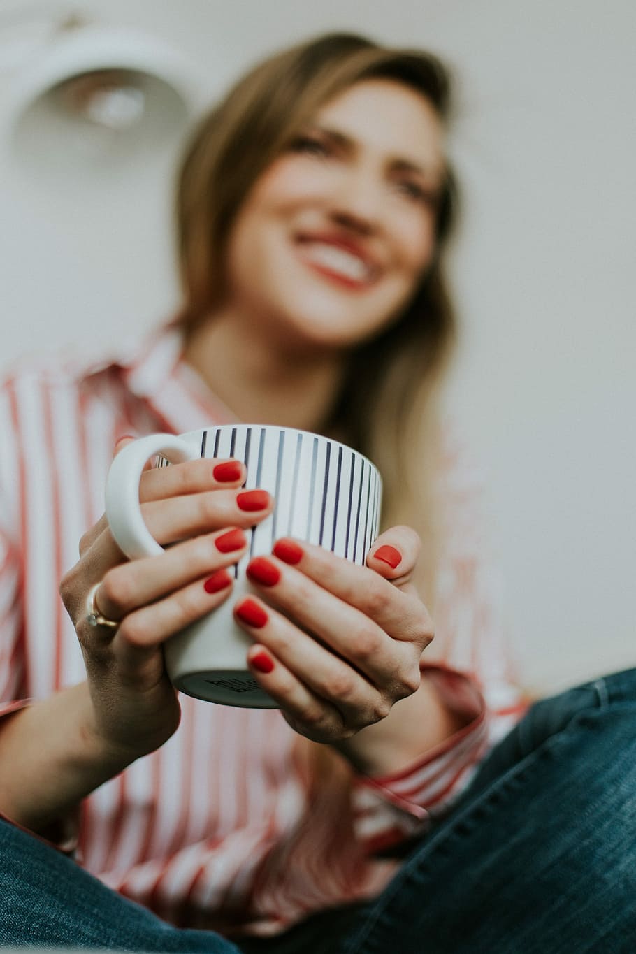 woman holding white and black ceramic mug, woman holding white and black ceramic cup selective photography HD wallpaper