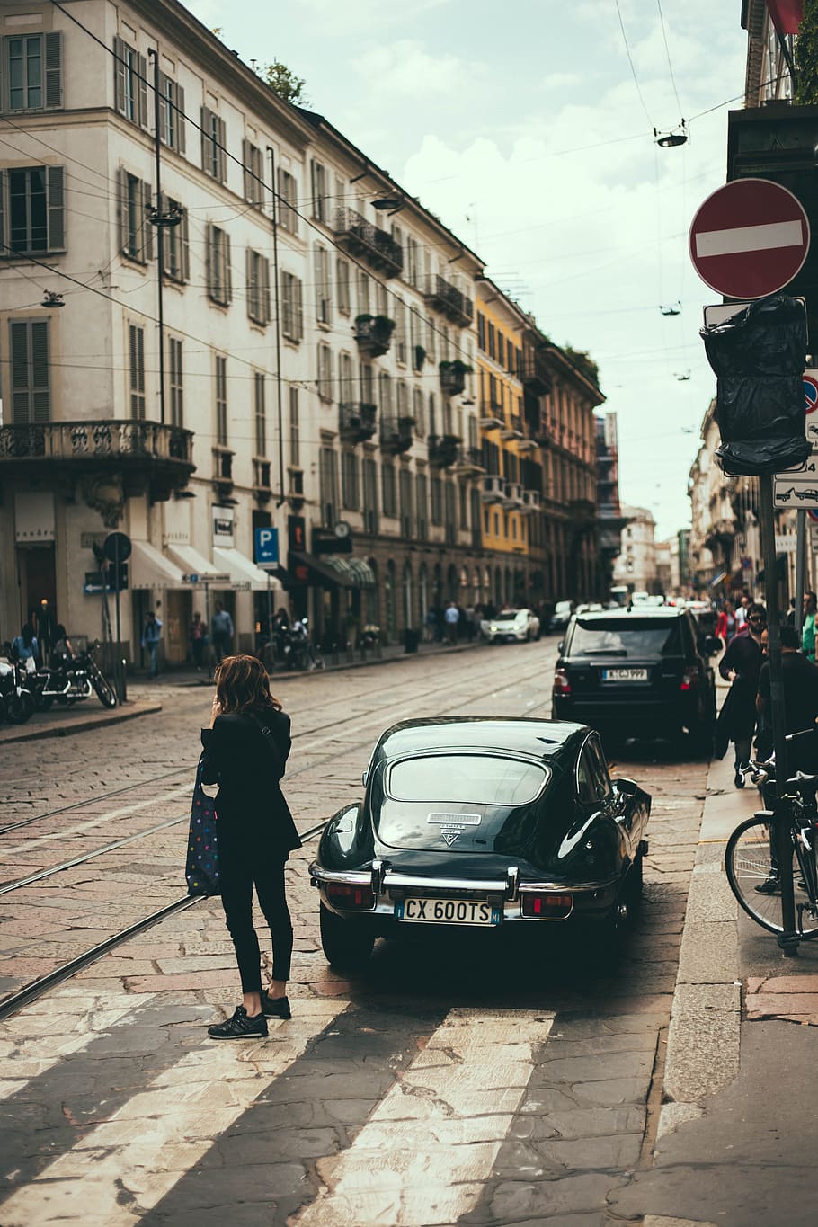 woman walking on street, woman in black coat standing beside black vehicle, HD wallpaper
