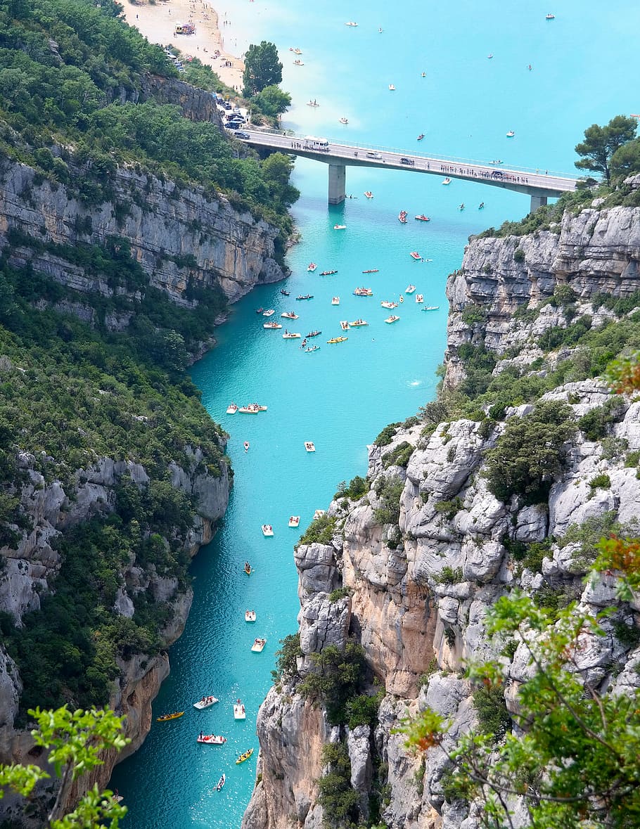 bridge over water between rock cliffs at daytime, mountain HD wallpaper