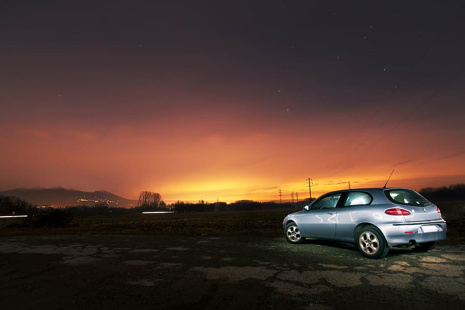 silver 3-door hatchback on dirt road at golden hour, car, vehicle