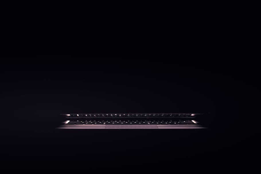Laptop computer sitting in a dark room, technology, black Color