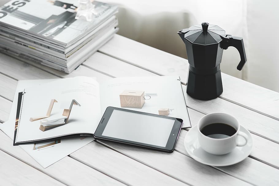 white ceramic teacup near black smartphone on table, technology HD wallpaper