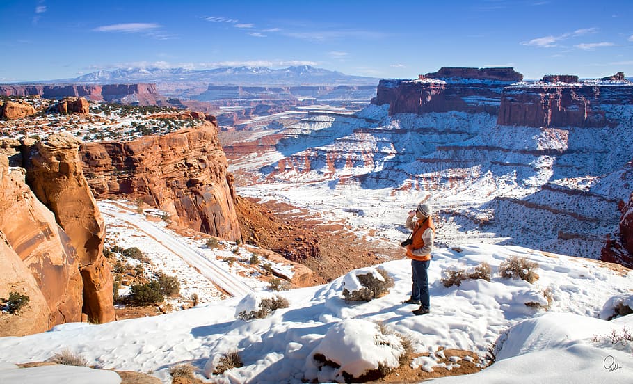 Canyon Lands, person standing on ice ground and facing at grand canyons HD wallpaper