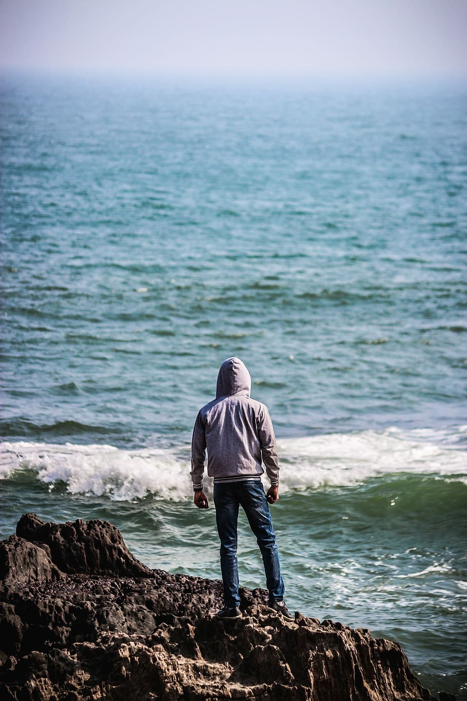 person standing on rock beside body of water, sea, ocean, wave HD wallpaper