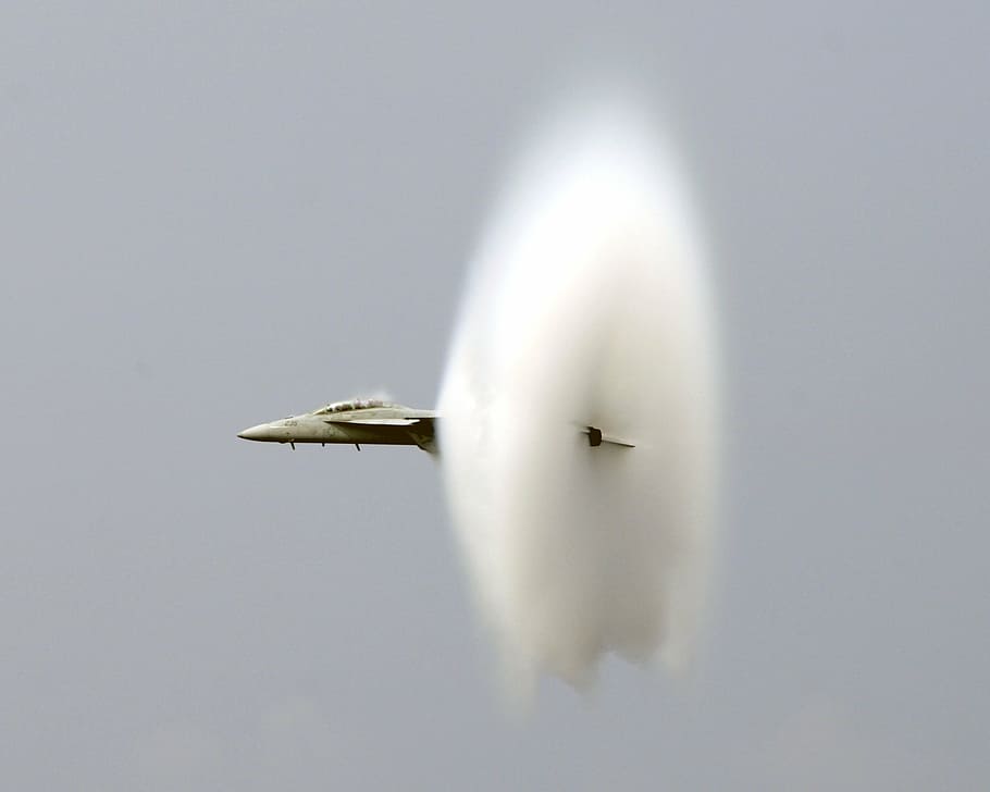 gray sonic fighter jet on air, breaking the sound barrier, us navy
