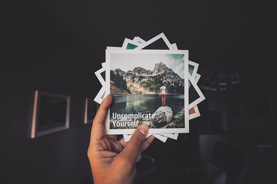 person holding cards, photo, phots, still, items, things, photographs HD wallpaper