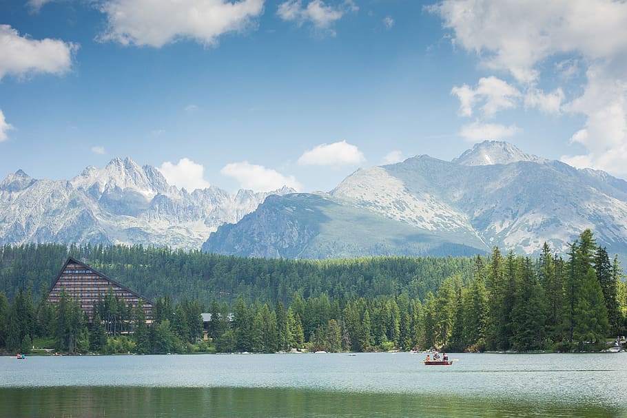 High Tatras Mountains Panorama Scenery with Lake and Woods, boat