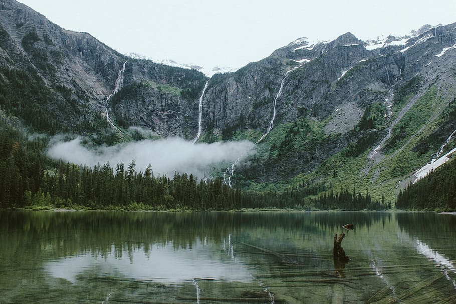 body of water surrounded by mountains, landscape photo of mountain HD wallpaper