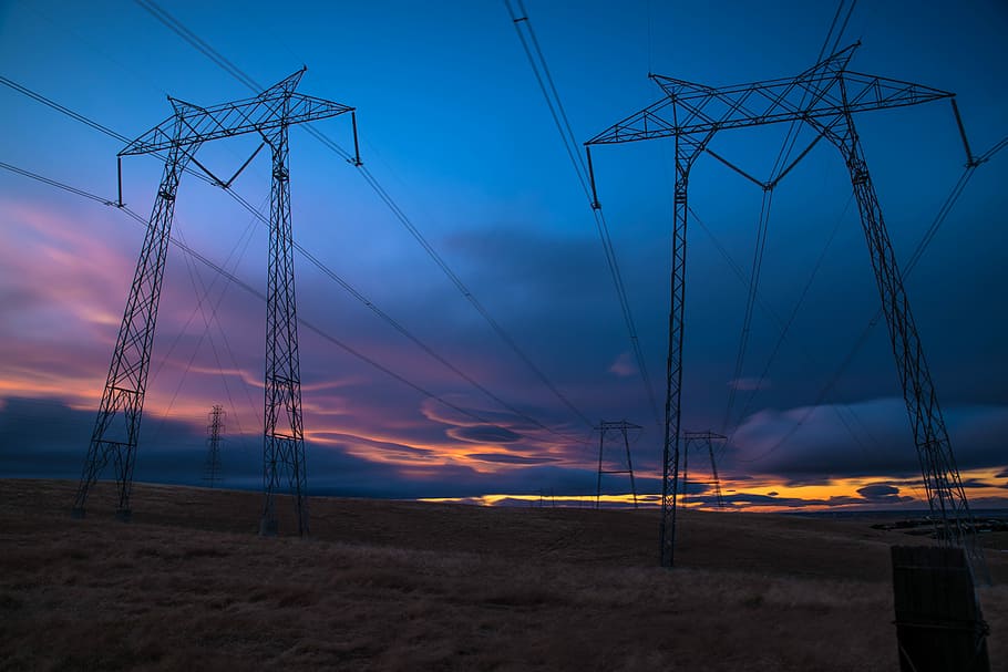electric post during sunset, two truss on ground, electric power transmission, HD wallpaper
