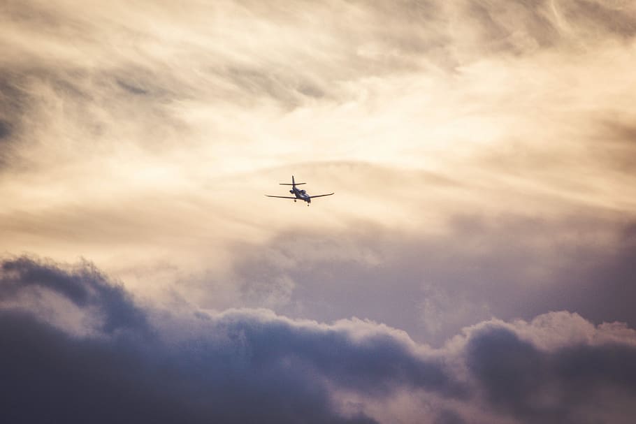 airliner at flight, airplane flying over grey cloudy skies, clouds HD wallpaper