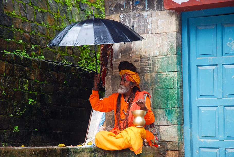 man holding black umbrella, guru, nepal, hinduism, sa, protection, HD wallpaper