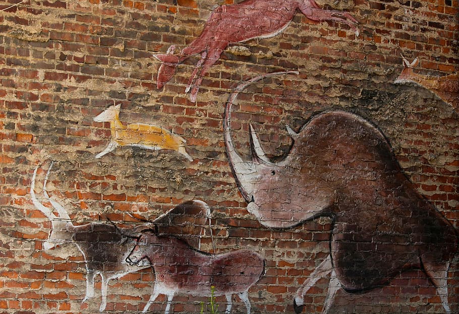 several assorted animals engraved on brown brick wall, wall mural, HD wallpaper