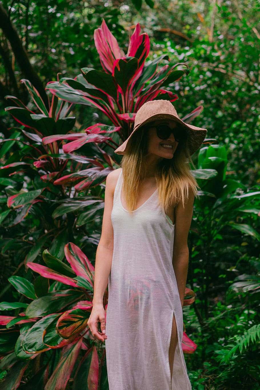 smiling woman in front of plant during daytime, woman wearing white dress standing near plant HD wallpaper